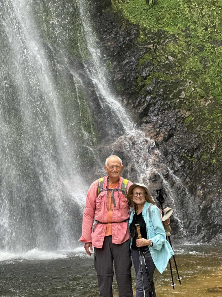 Couple visiting Silver Waterfall, famous trekking spot in Sapa Caption: A romantic stop at Silver Waterfall