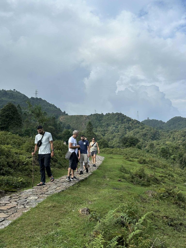 Group trekking to Love Waterfall (Thac Tinh Yeu) in Sapa Caption: Hiking to the hidden Love Waterfall